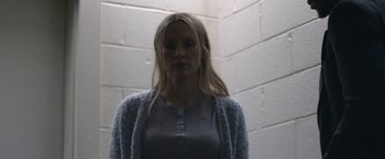 Movie still from “The Good Nurse” (2022), directed by Tobias Lindholm – A woman standing in a room with a brick wall behind her; Close Up shot, Low angle