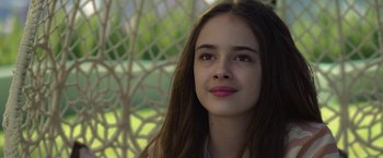 Movie still from “The Gray Man” (2022), directed by Joe Russo – A person with long hair; Close Up shot, Low angle