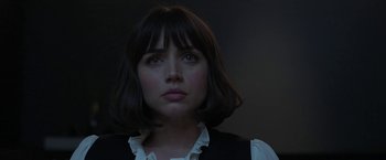 Movie still from “The Gray Man” (2022), directed by Joe Russo – A person wearing a dress shirt and vest; Close Up shot, Low angle