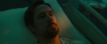 Movie still from “The Gray Man” (2022), directed by Joe Russo – A person laying in a hospital bed; Close Up shot, High angle