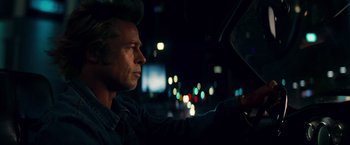 Movie still from “Once Upon a Time in Hollywood” (2019), directed by Quentin Tarantino – A man driving a car in the dark at night; Close Up shot, Over the shoulder angle