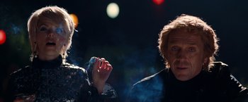 Movie still from “Once Upon a Time in Hollywood” (2019), directed by Quentin Tarantino – Two people are smoking a cigarette in the dark; Close Up shot, Low angle