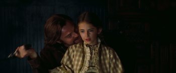 Movie still from “Once Upon a Time in Hollywood” (2019), directed by Quentin Tarantino – A man and a young girl are sitting together; Close Up shot, Over the shoulder angle