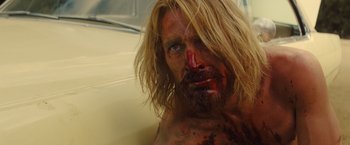 Movie still from “Once Upon a Time in Hollywood” (2019), directed by Quentin Tarantino – A person in a tub with blood on his face; Close Up shot, Low angle