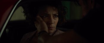 Movie still from “The Gunman” (2015), directed by Pierre Morel – A person looking at the camera; Close Up shot, Over the shoulder angle