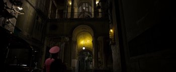 Movie still from “The Hand of God” (2021), directed by Paolo Sorrentino – A building that has a lot of lights in it; Extreme Wide shot, Low angle