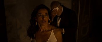 Movie still from “The Hand of God” (2021), directed by Paolo Sorrentino – A woman in a white shirt and a man in a suit; Close Up shot, Over the shoulder angle