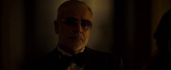 Movie still from “The Hand of God” (2021), directed by Paolo Sorrentino – An older man wearing a suit and bow tie; Close Up shot, Low angle