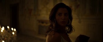 Movie still from “The Hand of God” (2021), directed by Paolo Sorrentino – A beautiful woman with long dark brown hair; Close Up shot, Over the shoulder angle