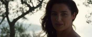 Movie still from “The Hand of God” (2021), directed by Paolo Sorrentino – A woman's face in front of a tree; Close Up shot, Over the shoulder angle