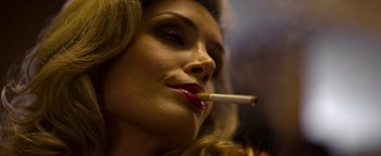 Movie still from “The Hand of God” (2021), directed by Paolo Sorrentino – A beautiful woman with a cigarette in her mouth; Close Up shot, Low angle