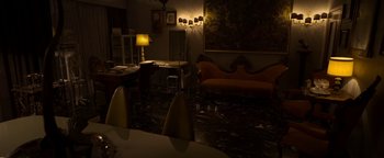 Movie still from “The Hand of God” (2021), directed by Paolo Sorrentino – A living room filled with furniture and a table; Extreme Wide shot, High angle