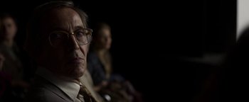 Movie still from “The Hand of God” (2021), directed by Paolo Sorrentino – An older man wearing glasses and a tie; Close Up shot, Low angle