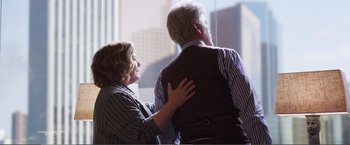 Movie still from “The Happytime Murders” (2018), directed by Brian Henson – An older man and a younger woman are hugging; Medium shot, Over the shoulder angle