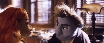 Movie still from “The Happytime Murders” (2018), directed by Brian Henson – A person with a stuffed animal in their hand; Close Up shot, Over the shoulder angle