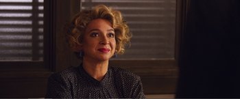 Movie still from “The Happytime Murders” (2018), directed by Brian Henson – A person wearing a black shirt; Close Up shot, Over the shoulder angle