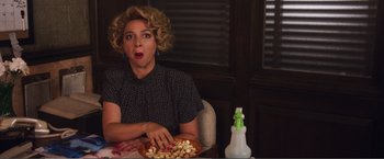 Movie still from “The Happytime Murders” (2018), directed by Brian Henson – A woman sitting in front of a plate of food; Close Up shot, Over the shoulder angle