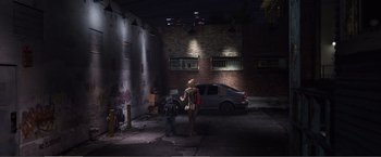 Movie still from “The Happytime Murders” (2018), directed by Brian Henson – Two people standing next to a car in a dark garage; Extreme Wide shot, High angle