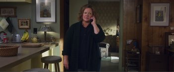Movie still from “The Happytime Murders” (2018), directed by Brian Henson – A woman is talking on a cell phone; Medium shot, High angle