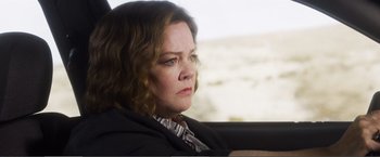 Movie still from “The Happytime Murders” (2018), directed by Brian Henson – A person sitting in a car; Close Up shot, Over the shoulder angle