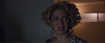 Movie still from “The Happytime Murders” (2018), directed by Brian Henson – A person with curly blonde hair; Close Up shot, Low angle