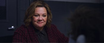 Movie still from “The Happytime Murders” (2018), directed by Brian Henson – A person wearing a jacket; Close Up shot, Over the shoulder angle