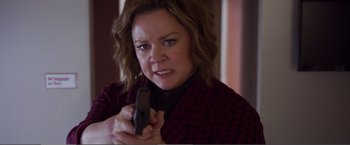 Movie still from “The Happytime Murders” (2018), directed by Brian Henson – A person holding a cell phone; Close Up shot, High angle