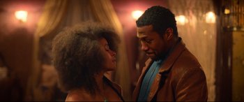 Movie still from “The Harder They Fall” (2021), directed by Jeymes Samuel – A man and a woman looking at one another; Close Up shot, Low angle