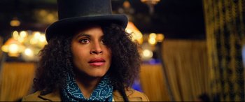 Movie still from “The Harder They Fall” (2021), directed by Jeymes Samuel – A person wearing a hat; Close Up shot, Low angle