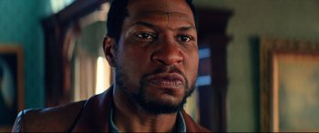 Movie still from “The Harder They Fall” (2021), directed by Jeymes Samuel – A person with a cross on his forehead; Close Up shot, Low angle