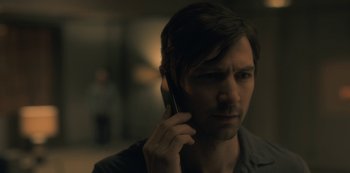 Movie still from “The Haunting of Hill House” (2018), directed by Mike Flanagan – A person talking on a cell phone; Close Up shot, Over the shoulder angle
