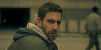 Movie still from “The Haunting of Hill House” (2018), directed by Mike Flanagan – A person wearing a jacket; Close Up shot, Over the shoulder angle