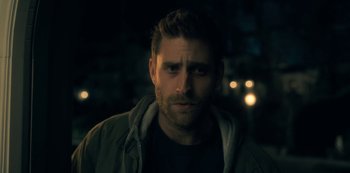 Movie still from “The Haunting of Hill House” (2018), directed by Mike Flanagan – A person wearing a jacket; Close Up shot, Low angle