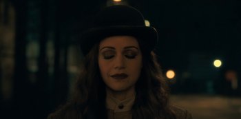 Movie still from “The Haunting of Hill House” (2018), directed by Mike Flanagan – A person wearing a hat; Close Up shot, High angle