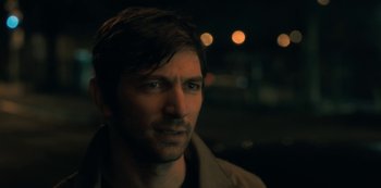 Movie still from “The Haunting of Hill House” (2018), directed by Mike Flanagan – A person wearing a jacket; Close Up shot, Over the shoulder angle