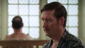 Movie still from “One Flew Over the Cuckoo's Nest” (1975), directed by Milos Forman – A person with a mustache; Close Up shot, Over the shoulder angle