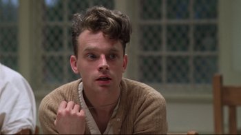 Movie still from “One Flew Over the Cuckoo's Nest” (1975), directed by Milos Forman – A man with a beard and a sweater on; Close Up shot, Low angle