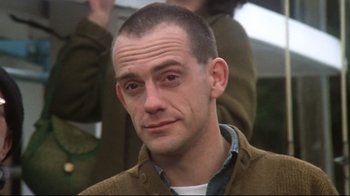 Movie still from “One Flew Over the Cuckoo's Nest” (1975), directed by Milos Forman – A person wearing a jacket; Close Up shot, Low angle