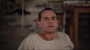 Movie still from “One Flew Over the Cuckoo's Nest” (1975), directed by Milos Forman – A person with his eyes wide open; Close Up shot, Low angle