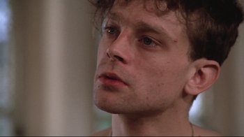 Movie still from “One Flew Over the Cuckoo's Nest” (1975), directed by Milos Forman – A man's face looking into the distance; Close Up shot, Low angle