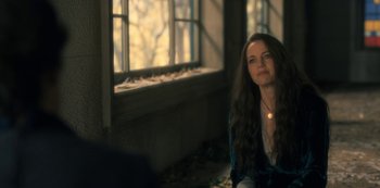 Movie still from “The Haunting of Hill House” (2018), directed by Mike Flanagan – A woman sitting in front of a large window; Close Up shot, Over the shoulder angle