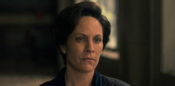 Movie still from “The Haunting of Hill House” (2018), directed by Mike Flanagan – A person with short hair; Close Up shot, Low angle