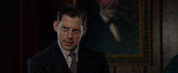 Movie still from “The Highwaymen” (2019), directed by John Lee Hancock – A person wearing a suit and tie; Close Up shot, Over the shoulder angle