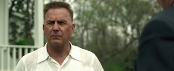 Movie still from “The Highwaymen” (2019), directed by John Lee Hancock – A person wearing a white shirt; Close Up shot, Low angle