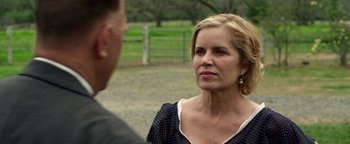 Movie still from “The Highwaymen” (2019), directed by John Lee Hancock – A man and a woman talking in a field; Close Up shot, Over the shoulder angle