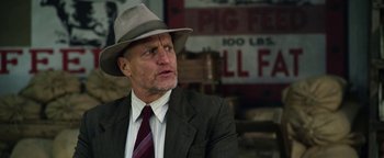 Movie still from “The Highwaymen” (2019), directed by John Lee Hancock – An older man in a suit and a hat; Close Up shot, Low angle