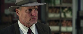 Movie still from “The Highwaymen” (2019), directed by John Lee Hancock – An older man wearing a suit and a hat; Close Up shot, Low angle