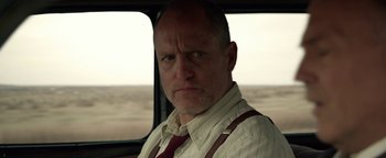 Movie still from “The Highwaymen” (2019), directed by John Lee Hancock – A man in a white shirt and a red tie; Close Up shot, Over the shoulder angle