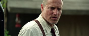 Movie still from “The Highwaymen” (2019), directed by John Lee Hancock – A man in a white dress shirt and red tie; Close Up shot, Low angle