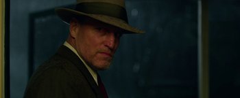 Movie still from “The Highwaymen” (2019), directed by John Lee Hancock – A person wearing a suit and a hat; Close Up shot, Low angle